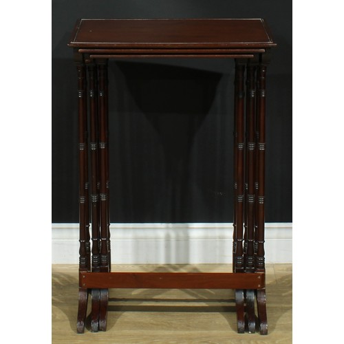 1370 - A nest of three George III Revival mahogany occasional tables, each with a rectangular top, turned s... 