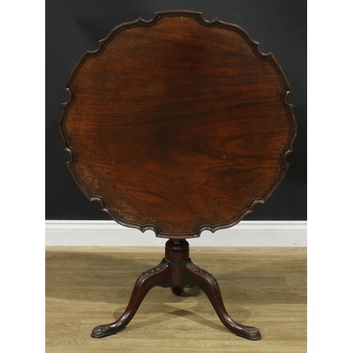 936 - A 19th century mahogany tripod occasional table, dished pie-crust tilting top, turned and fluted col... 