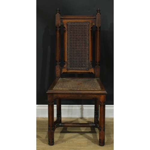 1398 - A pair of Gothic Revival oak hall chairs, cane back and seat, 104cm high, 47cm wide, the seat 39cm d... 