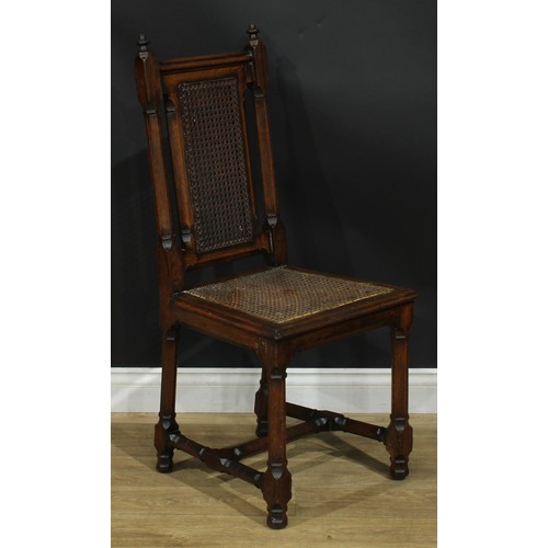 1398 - A pair of Gothic Revival oak hall chairs, cane back and seat, 104cm high, 47cm wide, the seat 39cm d... 