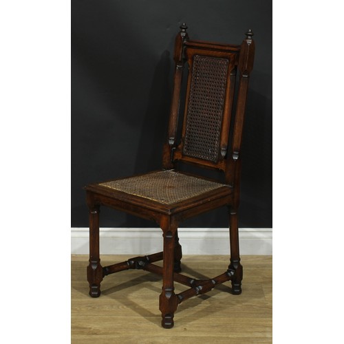 1398 - A pair of Gothic Revival oak hall chairs, cane back and seat, 104cm high, 47cm wide, the seat 39cm d... 