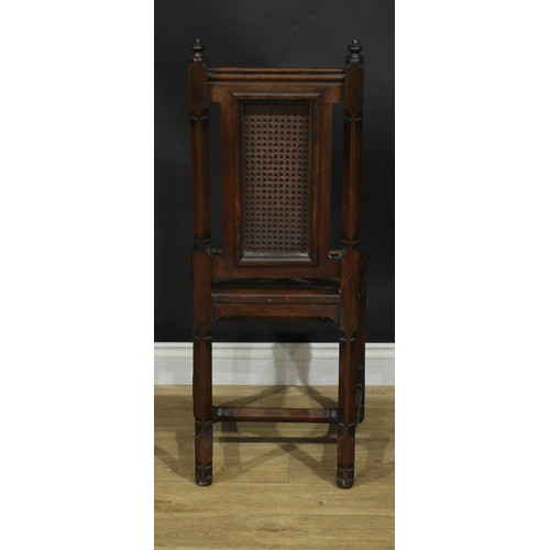 1398 - A pair of Gothic Revival oak hall chairs, cane back and seat, 104cm high, 47cm wide, the seat 39cm d... 