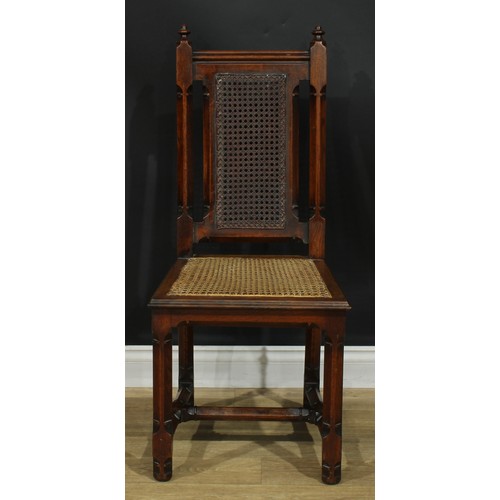 1398 - A pair of Gothic Revival oak hall chairs, cane back and seat, 104cm high, 47cm wide, the seat 39cm d... 