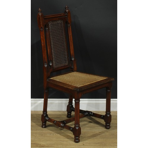 1398 - A pair of Gothic Revival oak hall chairs, cane back and seat, 104cm high, 47cm wide, the seat 39cm d... 