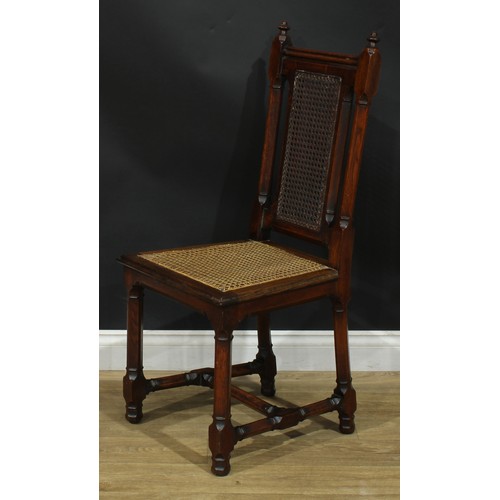 1398 - A pair of Gothic Revival oak hall chairs, cane back and seat, 104cm high, 47cm wide, the seat 39cm d... 