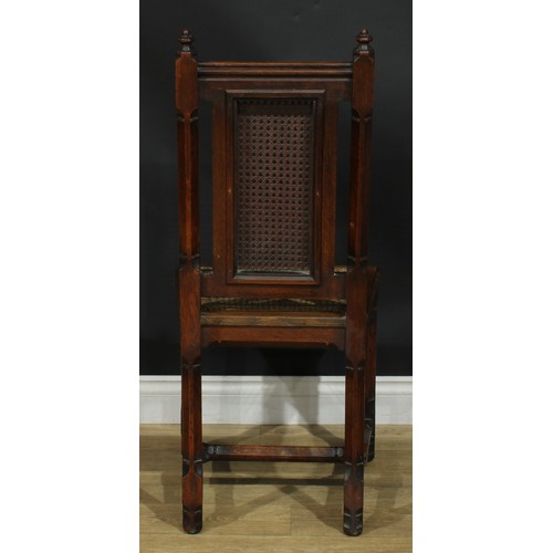 1398 - A pair of Gothic Revival oak hall chairs, cane back and seat, 104cm high, 47cm wide, the seat 39cm d... 