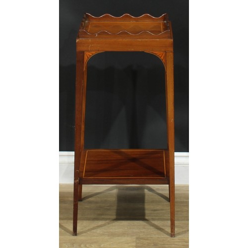 1175 - A George III Revival mahogany kettle stand, square top with wavy gallery, above a slide, batwing bra... 