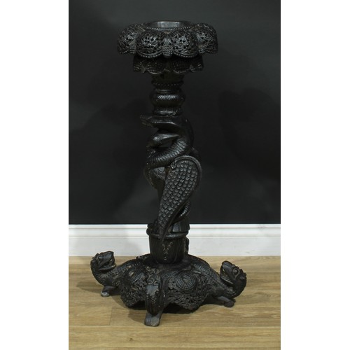 1318 - A late 19th century Burmese hardwood pedestal, shaped circular top pierced and carved with flowering... 