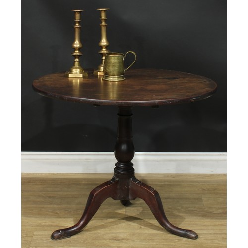 1236 - A George III mahogany tripod occasional table, one-piece circular tilting top, turned column, cabrio... 