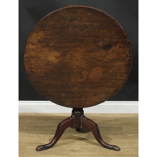 1236 - A George III mahogany tripod occasional table, one-piece circular tilting top, turned column, cabrio... 