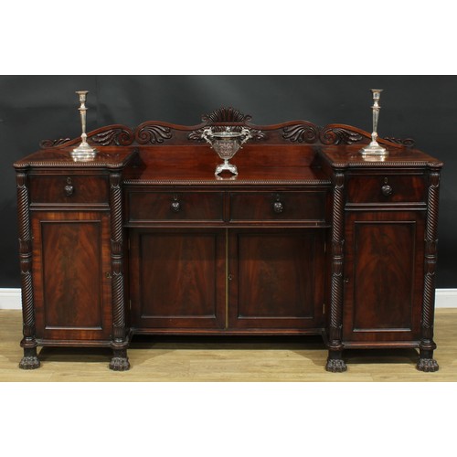 1416 - A Post-Regency mahogany sunken-centre serving table or sideboard, shaped half gallery carved with sc... 