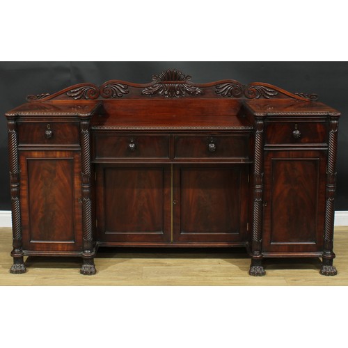 1416 - A Post-Regency mahogany sunken-centre serving table or sideboard, shaped half gallery carved with sc... 