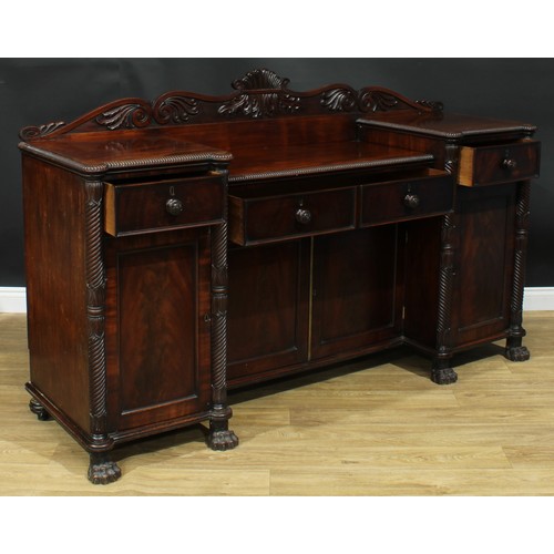 1416 - A Post-Regency mahogany sunken-centre serving table or sideboard, shaped half gallery carved with sc... 