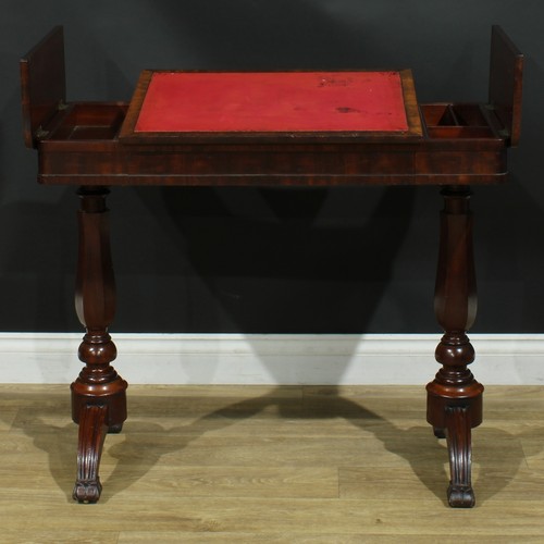 911 - A 19th century mahogany architect’s drafting or writing table, rounded rectangular top with angle-ad... 