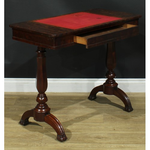 911 - A 19th century mahogany architect’s drafting or writing table, rounded rectangular top with angle-ad... 