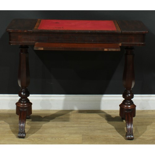 911 - A 19th century mahogany architect’s drafting or writing table, rounded rectangular top with angle-ad... 