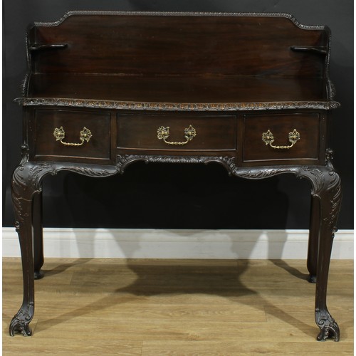 1097 - A George II Revival mahogany serpentine washstand, shaped three-quarter gallery above three frieze d... 