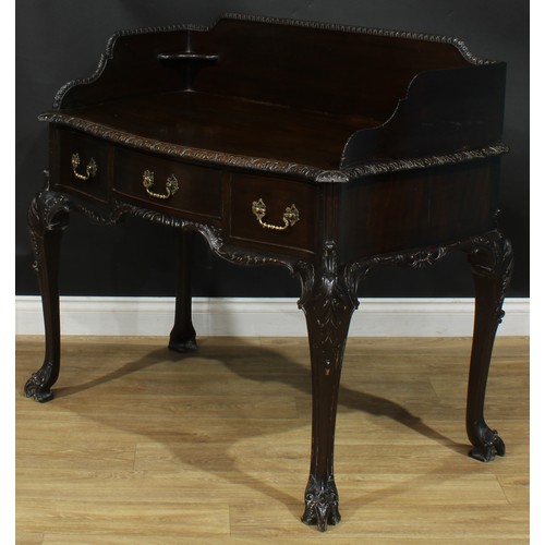 1097 - A George II Revival mahogany serpentine washstand, shaped three-quarter gallery above three frieze d... 