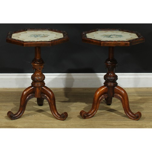 1411 - A pair of Victorian walnut tripod occasional tables, each with an octagonal top with inset glazed wa... 