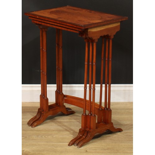 1178 - A George III Revival satinwoood nest of three occasional tables, each with a rectangular top and rin... 