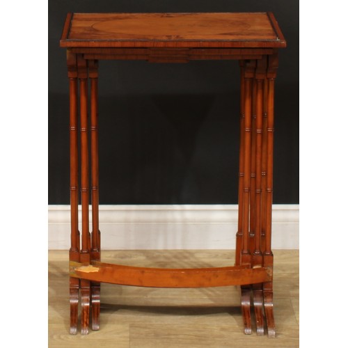 1178 - A George III Revival satinwoood nest of three occasional tables, each with a rectangular top and rin... 