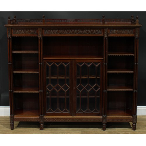 1050 - A Chippendale Revival mahogany low library bookcase, rectangular top with pierced three-quarter gall... 