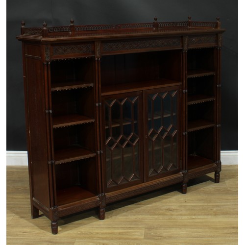 1050 - A Chippendale Revival mahogany low library bookcase, rectangular top with pierced three-quarter gall... 