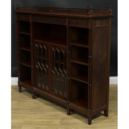 1050 - A Chippendale Revival mahogany low library bookcase, rectangular top with pierced three-quarter gall... 