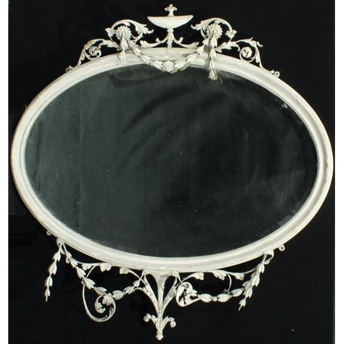 1361 - An Adam Revival painted gesso oval wall mirror, urn finial flanked by swags and leafy scrolls, confo... 