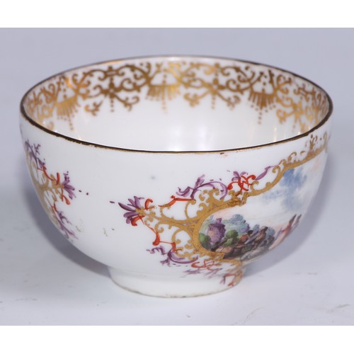 525 - A Meissen tea bowl and saucer, painted in polychrome with harbour views, gilt borders, the saucer 12... 