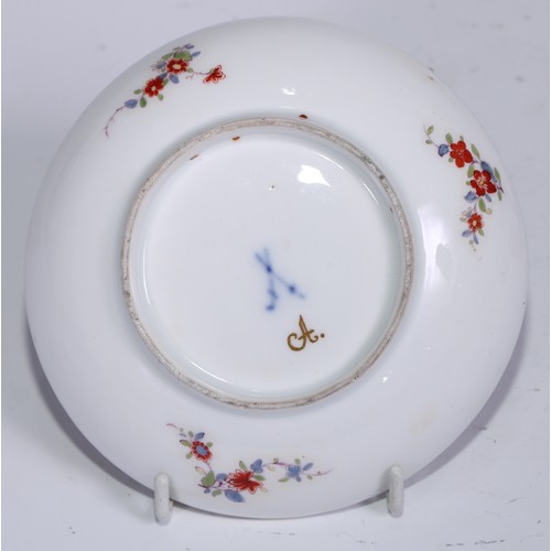 525 - A Meissen tea bowl and saucer, painted in polychrome with harbour views, gilt borders, the saucer 12... 