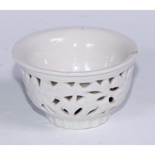 738 - A Chinese blanc de chine reticulated wine cup, 7.5cm diam, hardwood stand