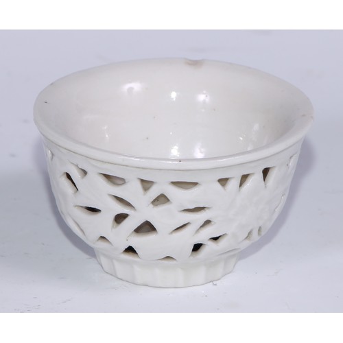 738 - A Chinese blanc de chine reticulated wine cup, 7.5cm diam, hardwood stand