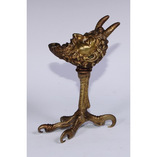 206 - A Renaissance Revival gilt bronze lamp, cast as the head of Pan, raised on a talon support, 20cm hig... 