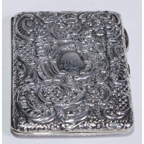 239 - A Victorian silver rounded rectangular combination aide memoir and card case, profusely embossed wit... 