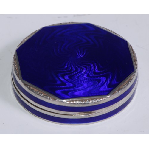 259 - An Art Deco silver and blue guilloche enamel rouge box, hinged cover enclosing a mirror, 5cm diam, L... 