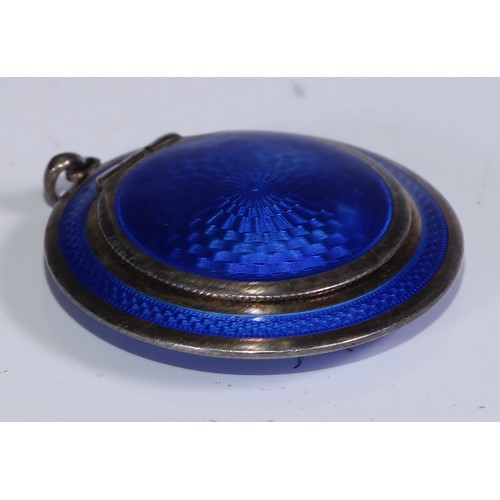 259 - An Art Deco silver and blue guilloche enamel rouge box, hinged cover enclosing a mirror, 5cm diam, L... 