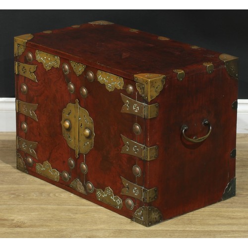 1021 - A Chinese brass mounted enclosed table cabinet, flush rectangular top above a pair of yumu veneer pa... 