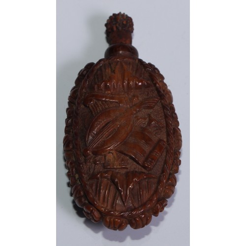 815 - A 19th century coquilla nut scent bottle, carved with a bust length portrait of a lady, 7cm long