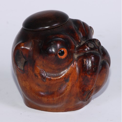 1073 - A Black Forest novelty table snuff box or inkwell, carved as the head of a bulldog, domed cover, gla... 