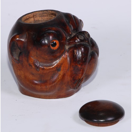 1073 - A Black Forest novelty table snuff box or inkwell, carved as the head of a bulldog, domed cover, gla... 