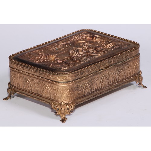 1248 - A French gilt metal rounded rectangular table casket, hinged cover with electrotype panel in the man... 