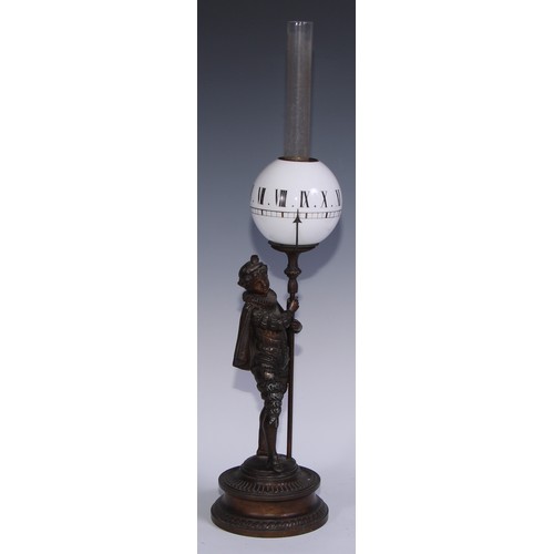 963 - A 19th century figural night clock, opaque glass globe inscribed with Roman numerals, the patinated ... 