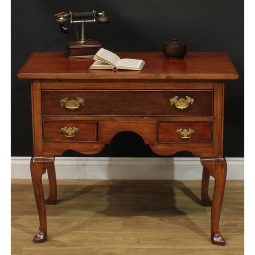 1095 - A George II Revival mahogany lowboy or side table, rectangular top with moulded edge above one long ... 