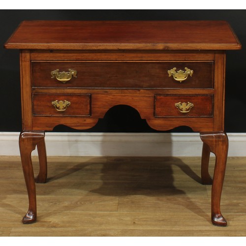 1095 - A George II Revival mahogany lowboy or side table, rectangular top with moulded edge above one long ... 