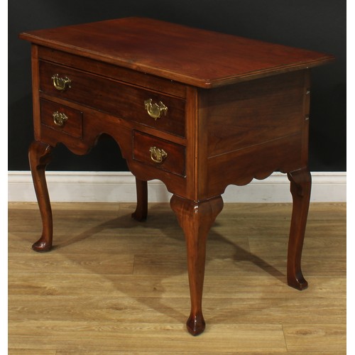 1095 - A George II Revival mahogany lowboy or side table, rectangular top with moulded edge above one long ... 