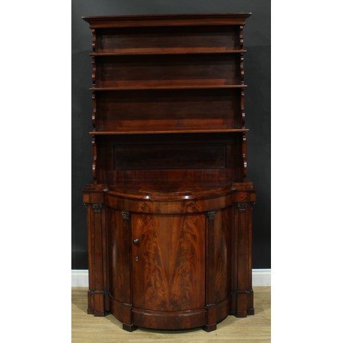 898 - A 19th century flame mahogany library bookcase side cabinet, outswept cornice above three waterfall ... 