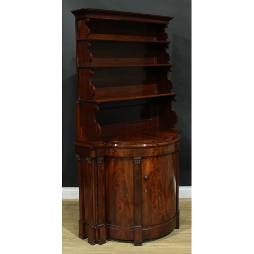 898 - A 19th century flame mahogany library bookcase side cabinet, outswept cornice above three waterfall ... 