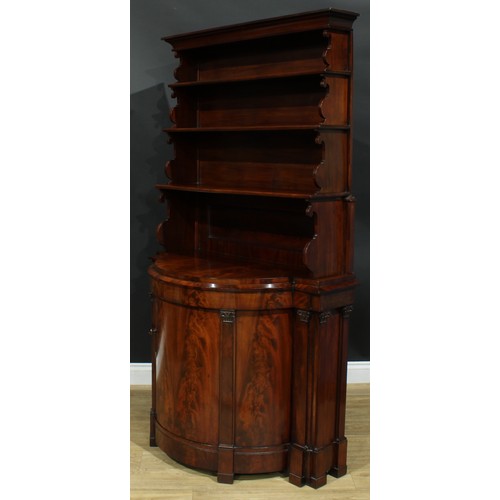 898 - A 19th century flame mahogany library bookcase side cabinet, outswept cornice above three waterfall ... 