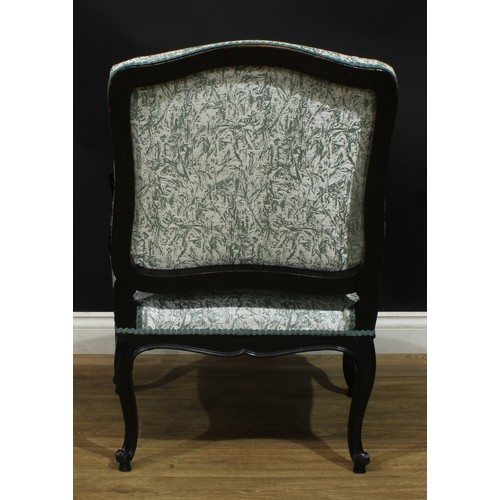 1401 - A pair of Louis XV Revival ebonised fauteuils, each with stuffed-over upholstery, shaped arms carved... 